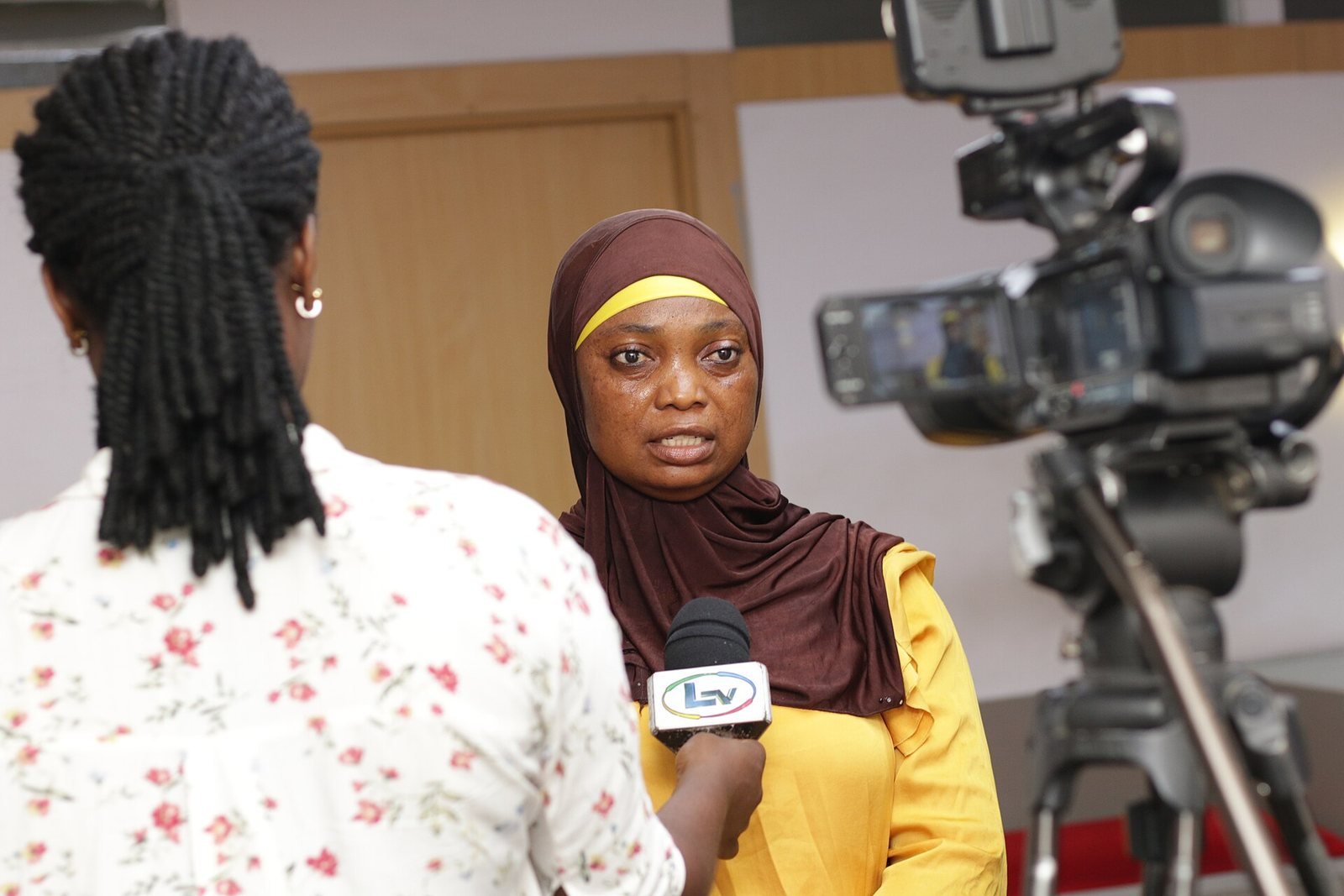 A news interview being filmed
